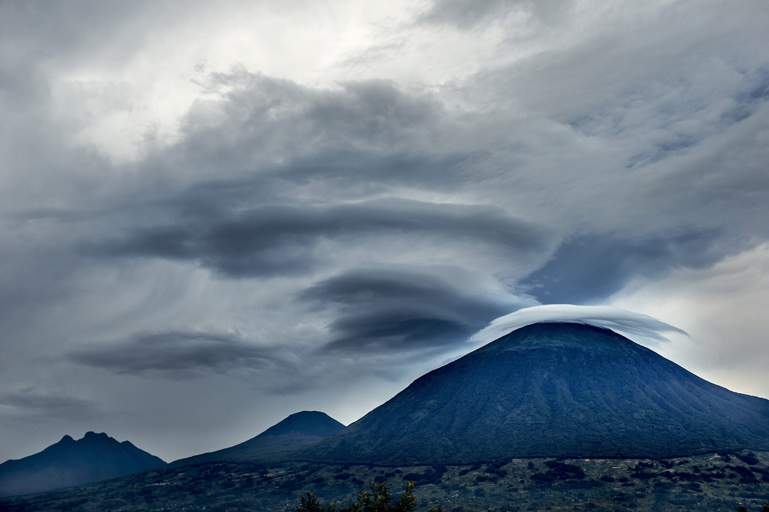 Sunset over Rwanda's Virunga volcanoes viewed from the foothills